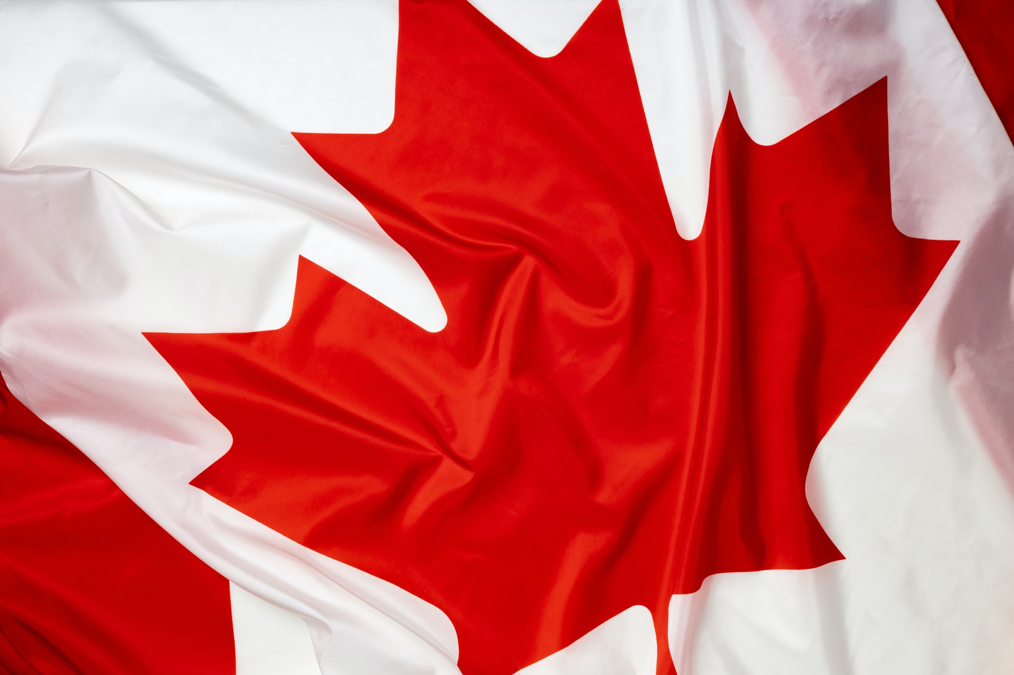 Rippled textile flag of Canada close up